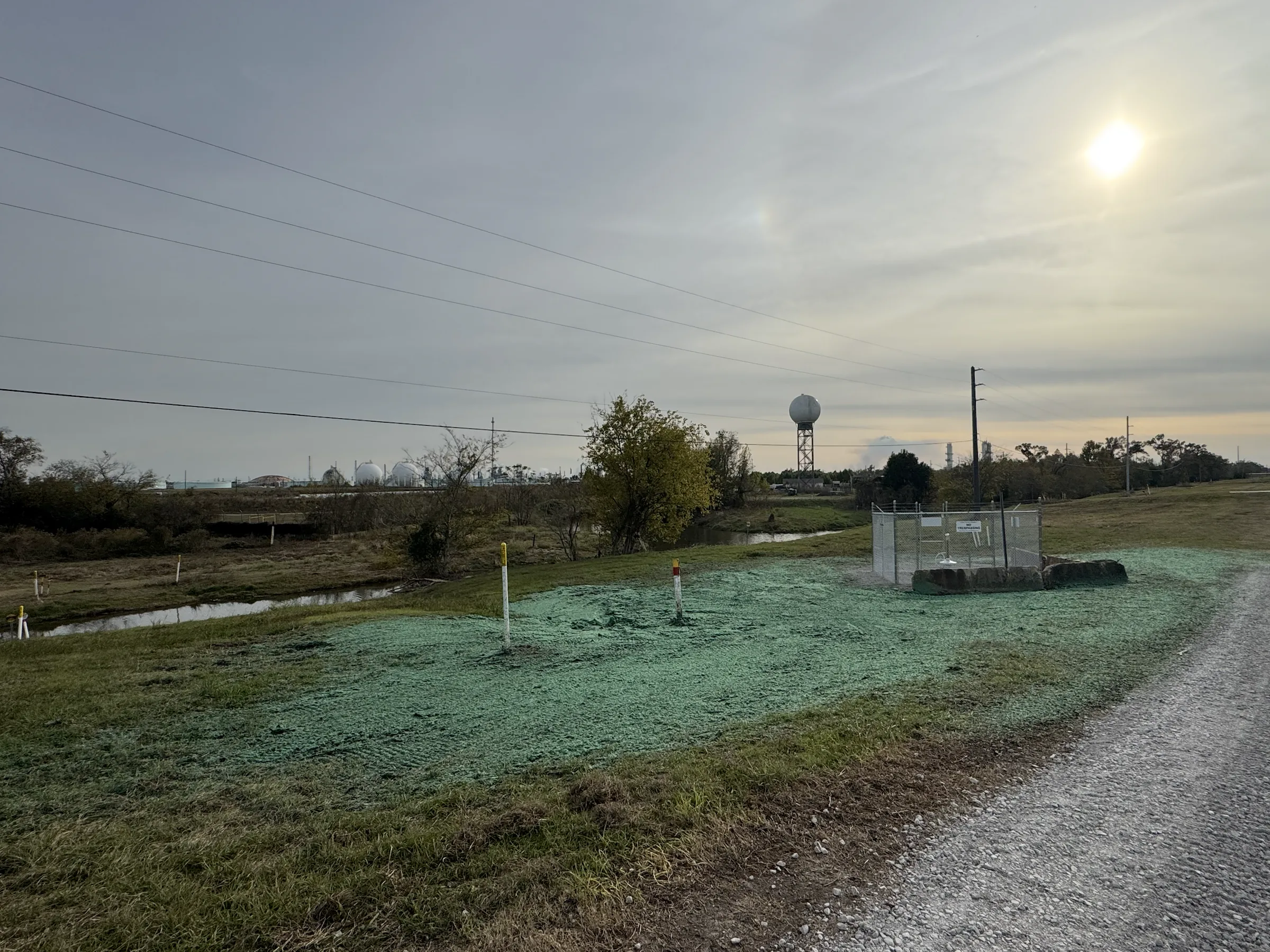 Application equipment and crew working along disturbed pipeline ground