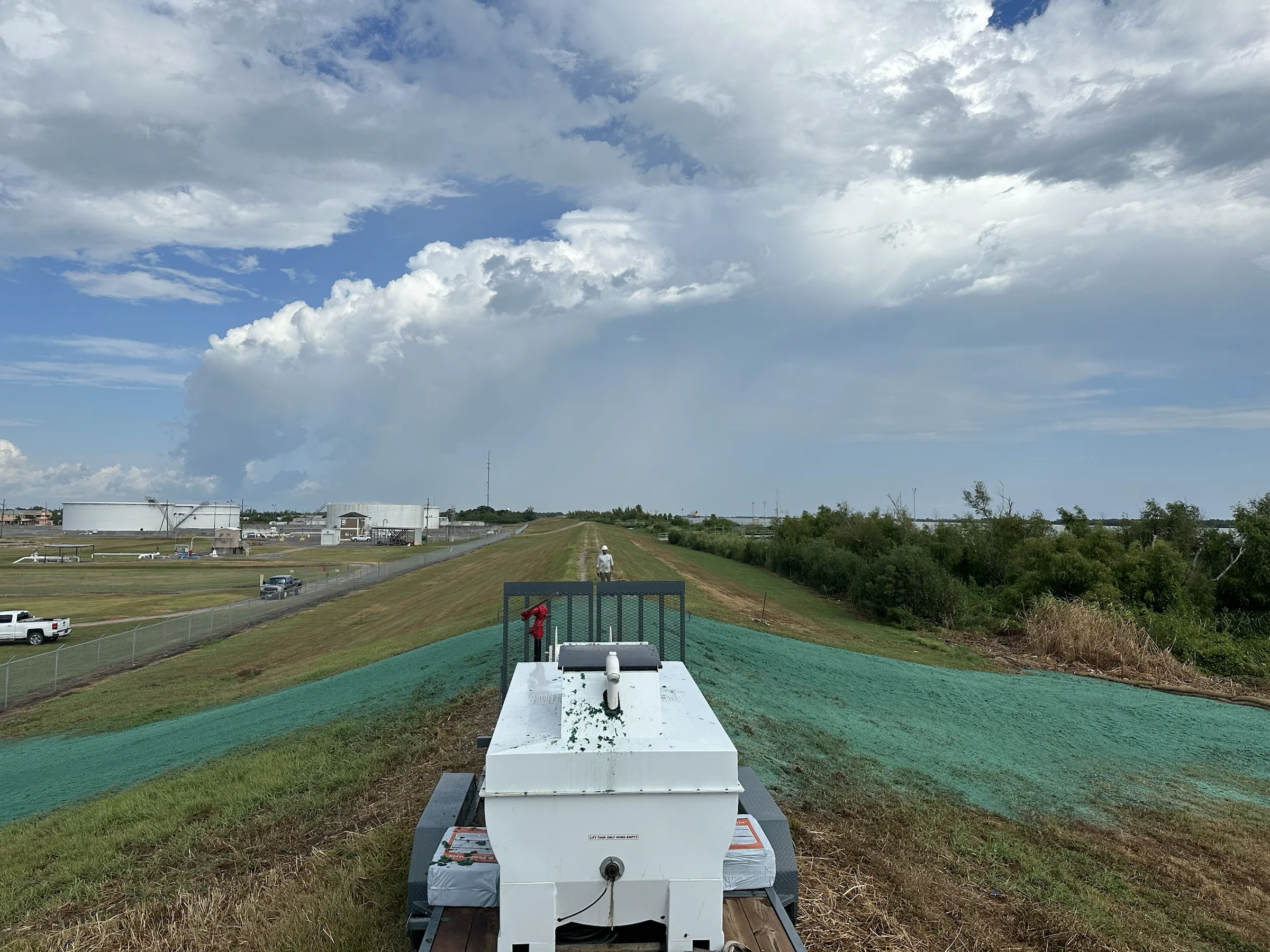 Hydroseed being applied across levee ground in Venice, Louisiana